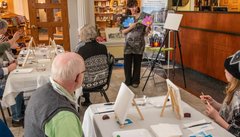Showing samples to Paint Party guests